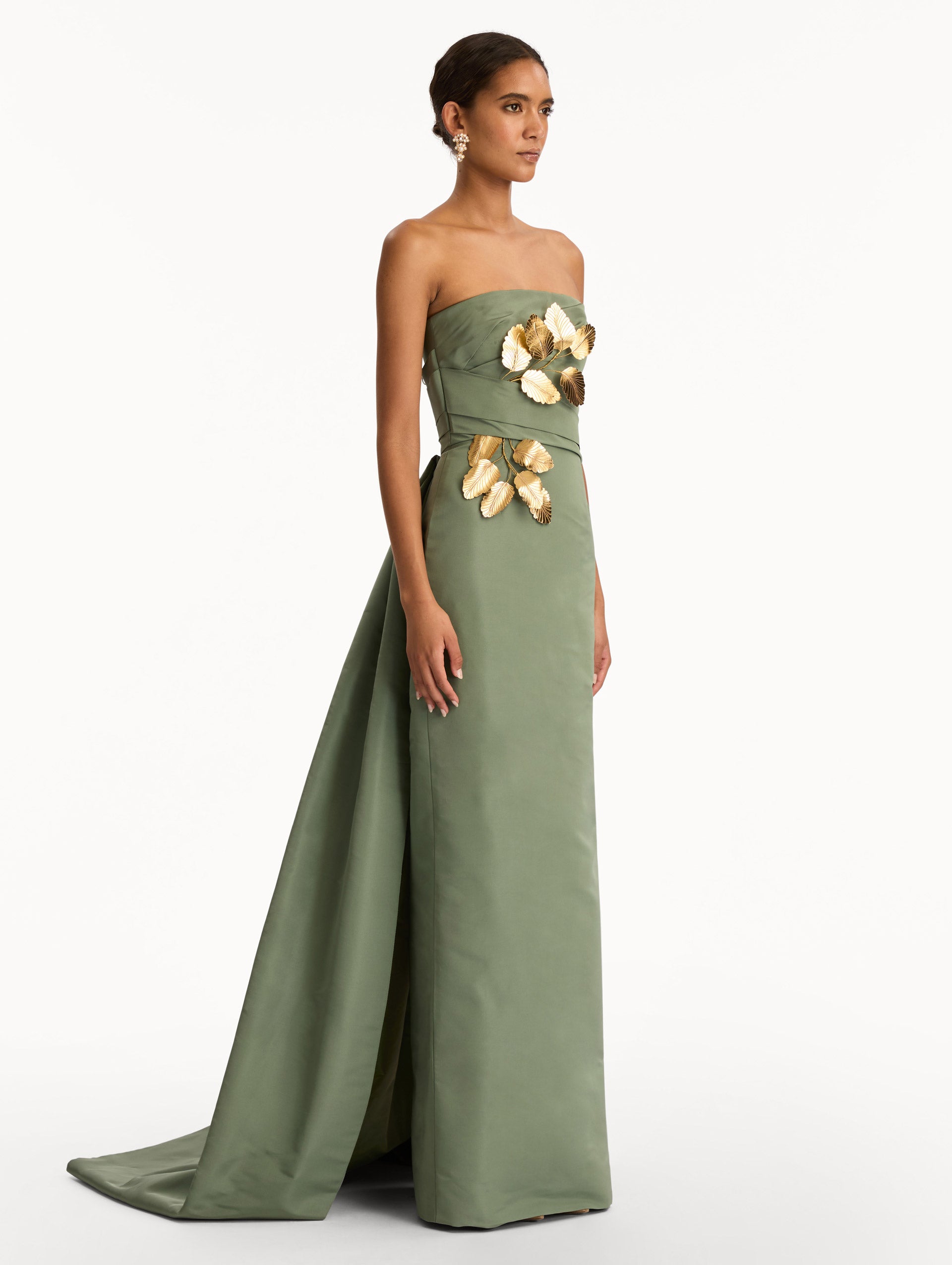 Green Gold Leaf Embroidered Faille Gown with strapless neckline and wrapped bodice. Side View.