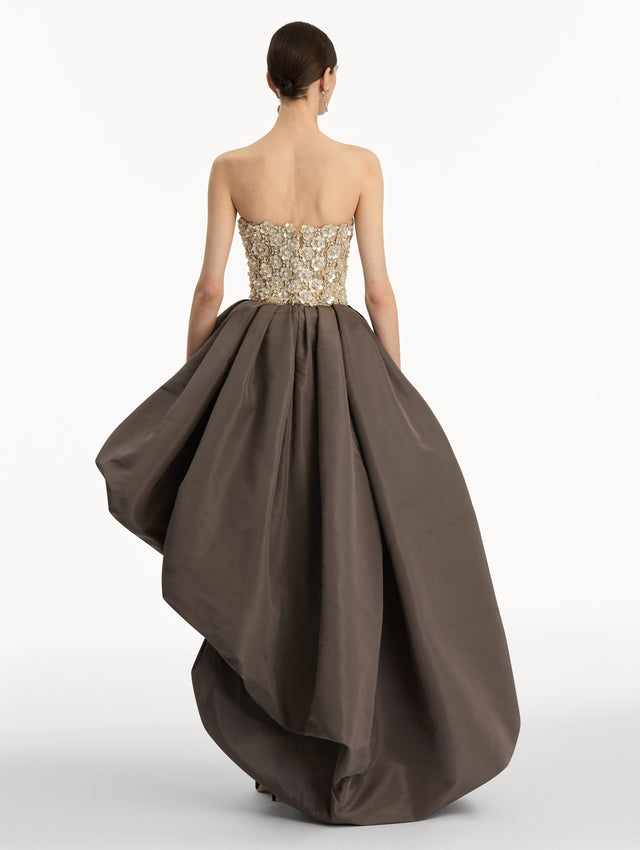 Brown and Beige Mother of Pearl Embroidered High-Low Gown with brown draped skirt and embroidered strapless bodice. Back View.