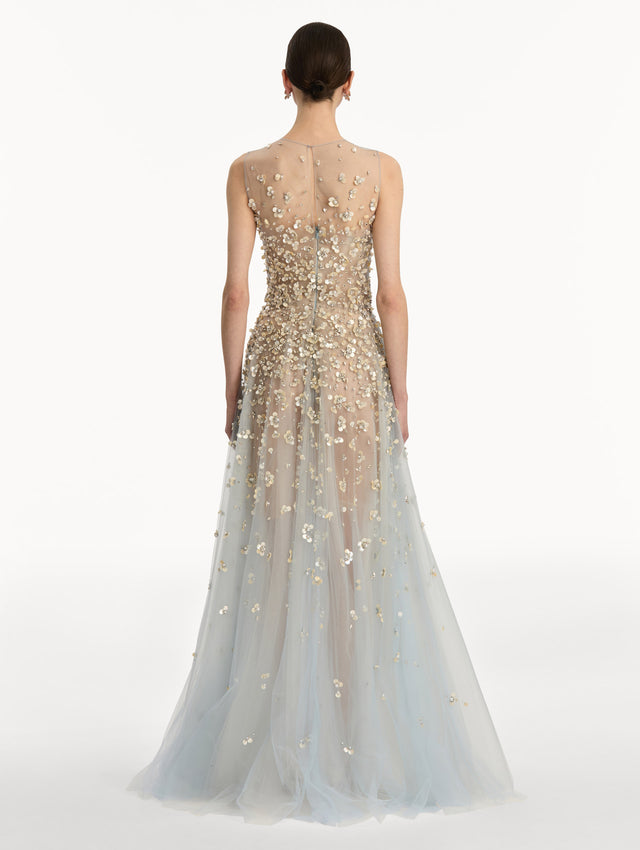 Tan and pale blue Mother of Pearl Embroidered Illusion Gown with flowing embellished skirt and scattered floral appliques. Back View.