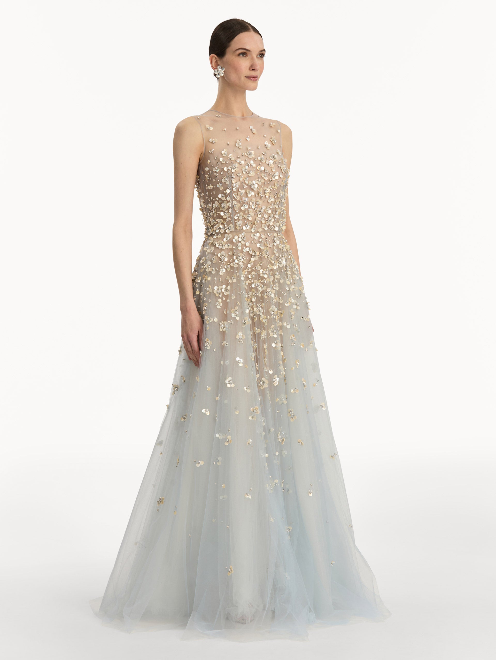 Tan and pale blue Mother of Pearl Embroidered Illusion Gown with flowing embellished skirt and scattered floral appliques. Side View.