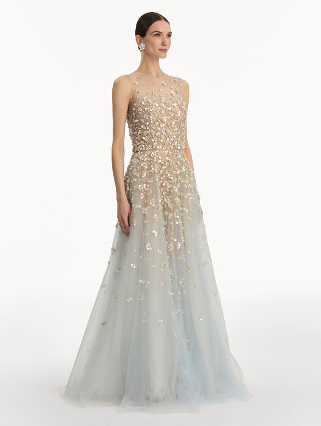 Tan and pale blue Mother of Pearl Embroidered Illusion Gown with flowing embellished skirt and scattered floral appliques. Side View.