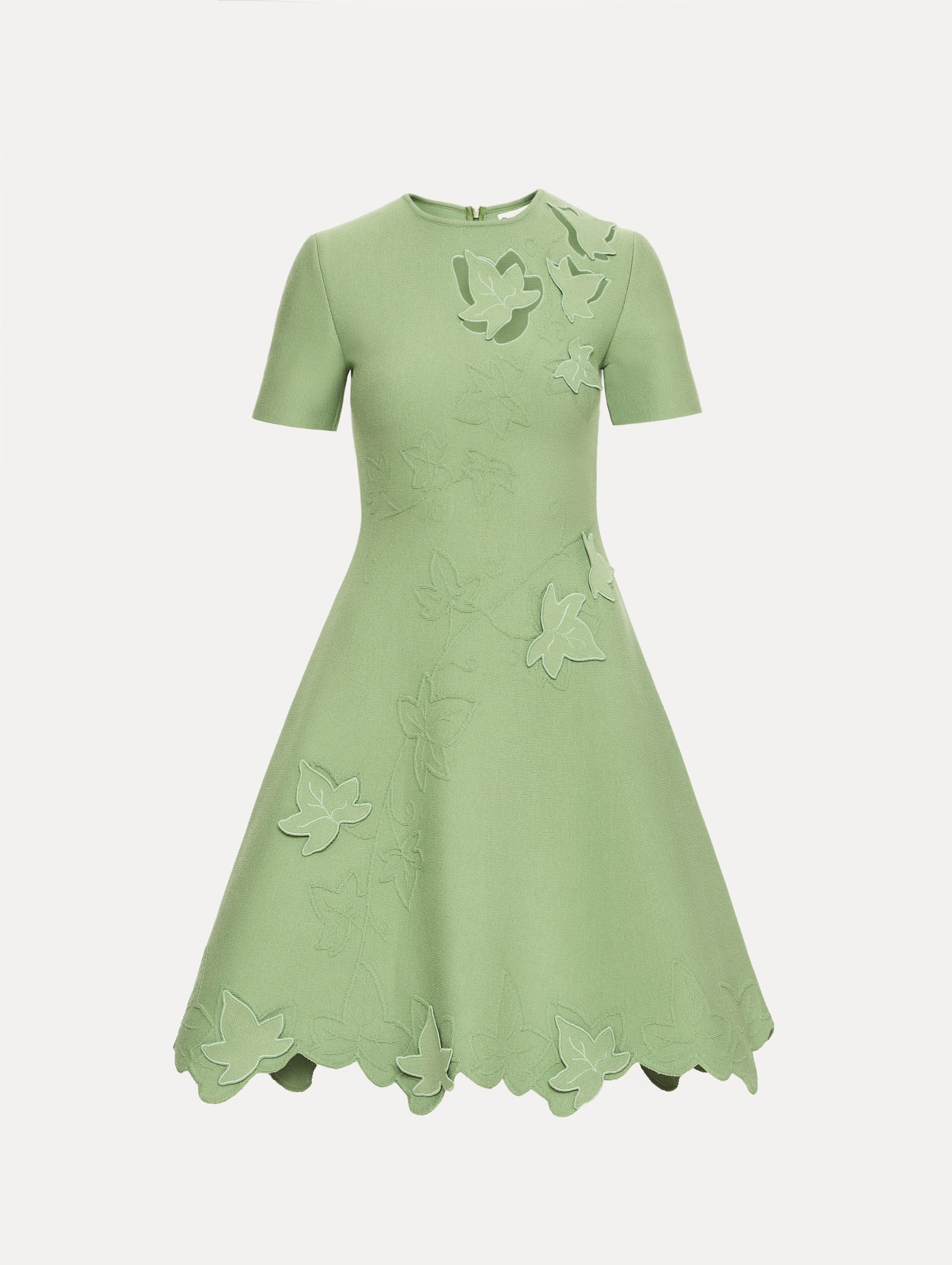 Green Ivy Cutout Knit Dress featuring short sleeves, leaf appliqué detailing, and scalloped hem.