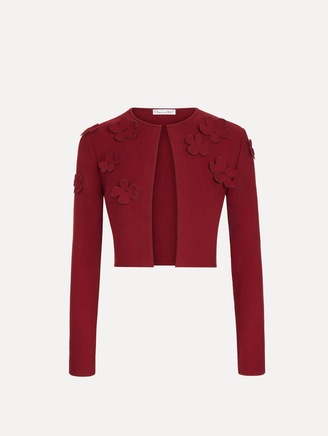 The Laser-Cut Floral Knit Cardigan in a wine, red color with sculptural floral appliqués. Front View.