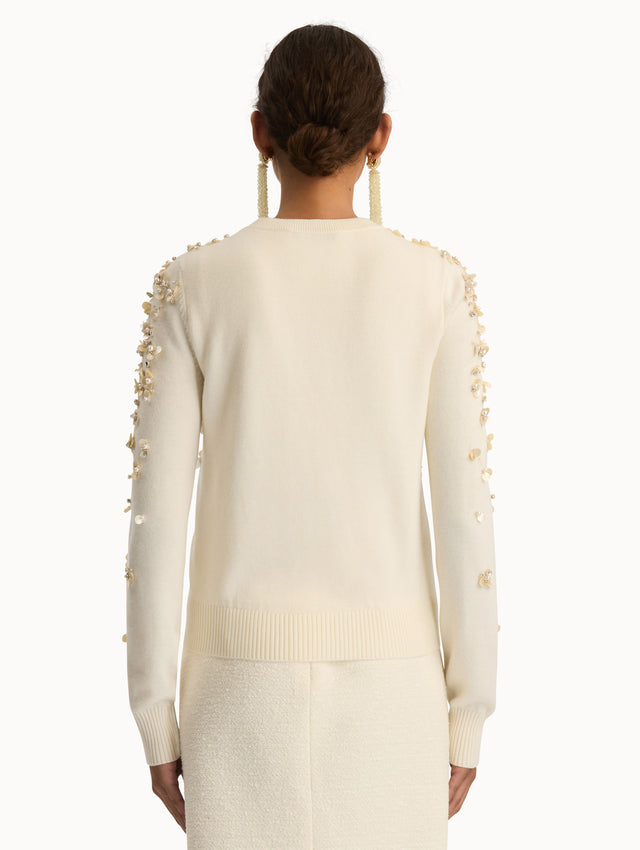 Ivory Mother of Pearl Embroidered Cardigan featuring a crew neckline, button front, and sequin floral embellishments throughout. Back View.