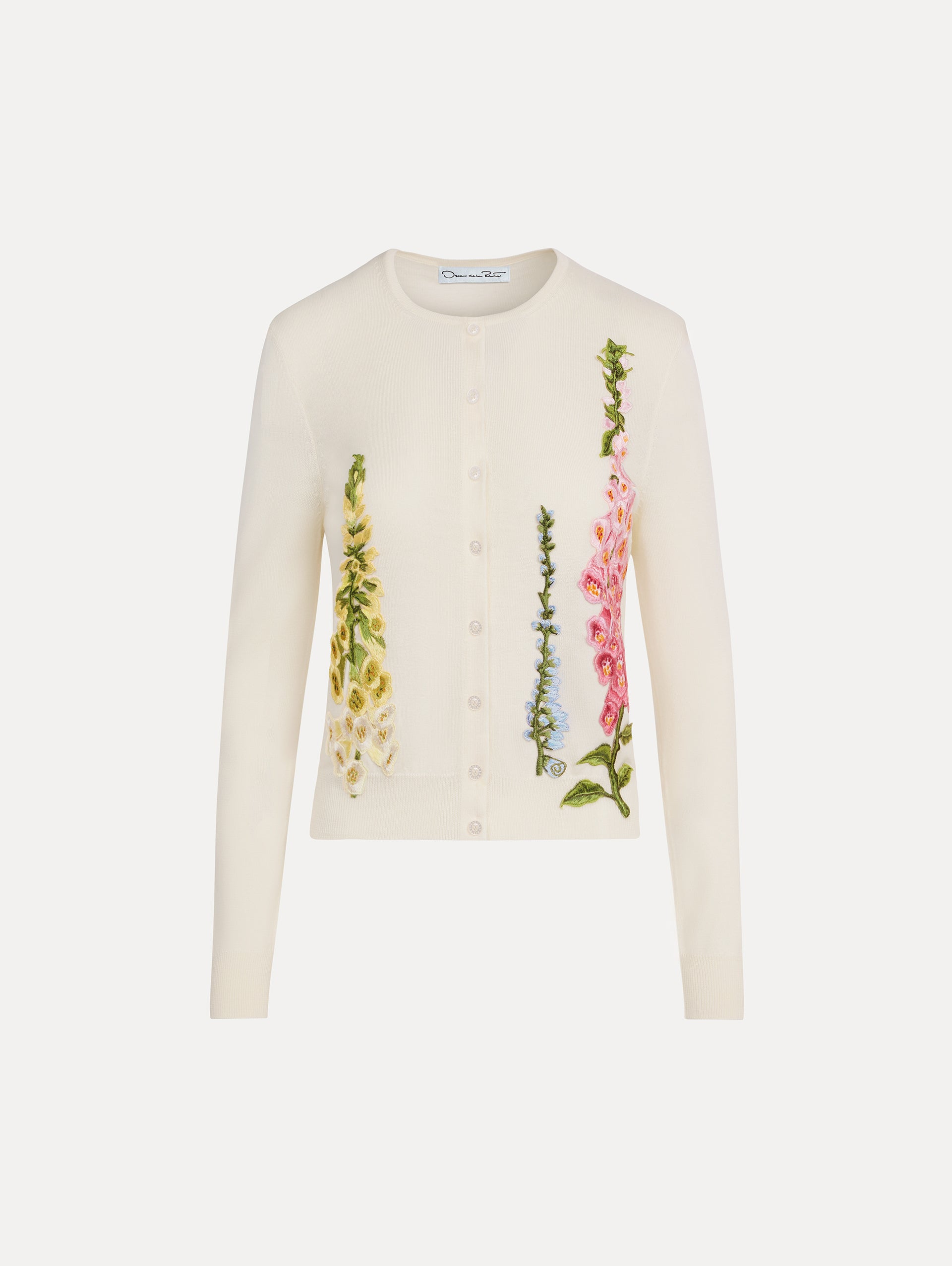 White Foxglove Threadwork Cardigan with climbing yellow and pink floral applique. Front View.