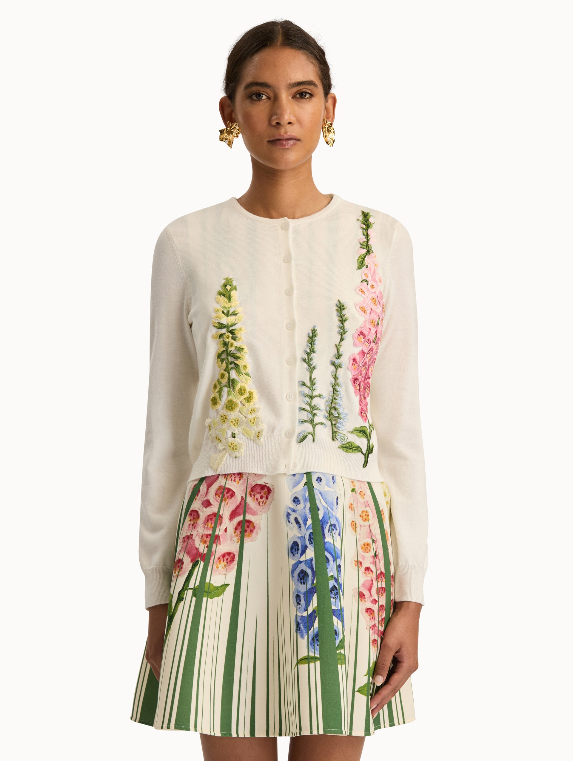 White Foxglove Threadwork Cardigan with climbing yellow and pink floral applique. Front View.