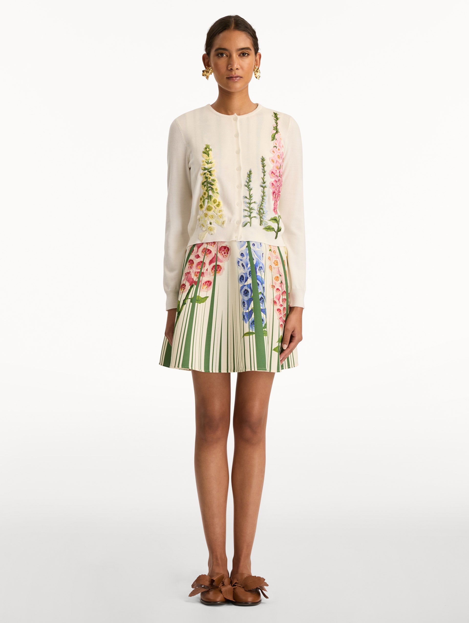 White Foxglove Threadwork Cardigan with climbing yellow and pink floral applique. Front View.