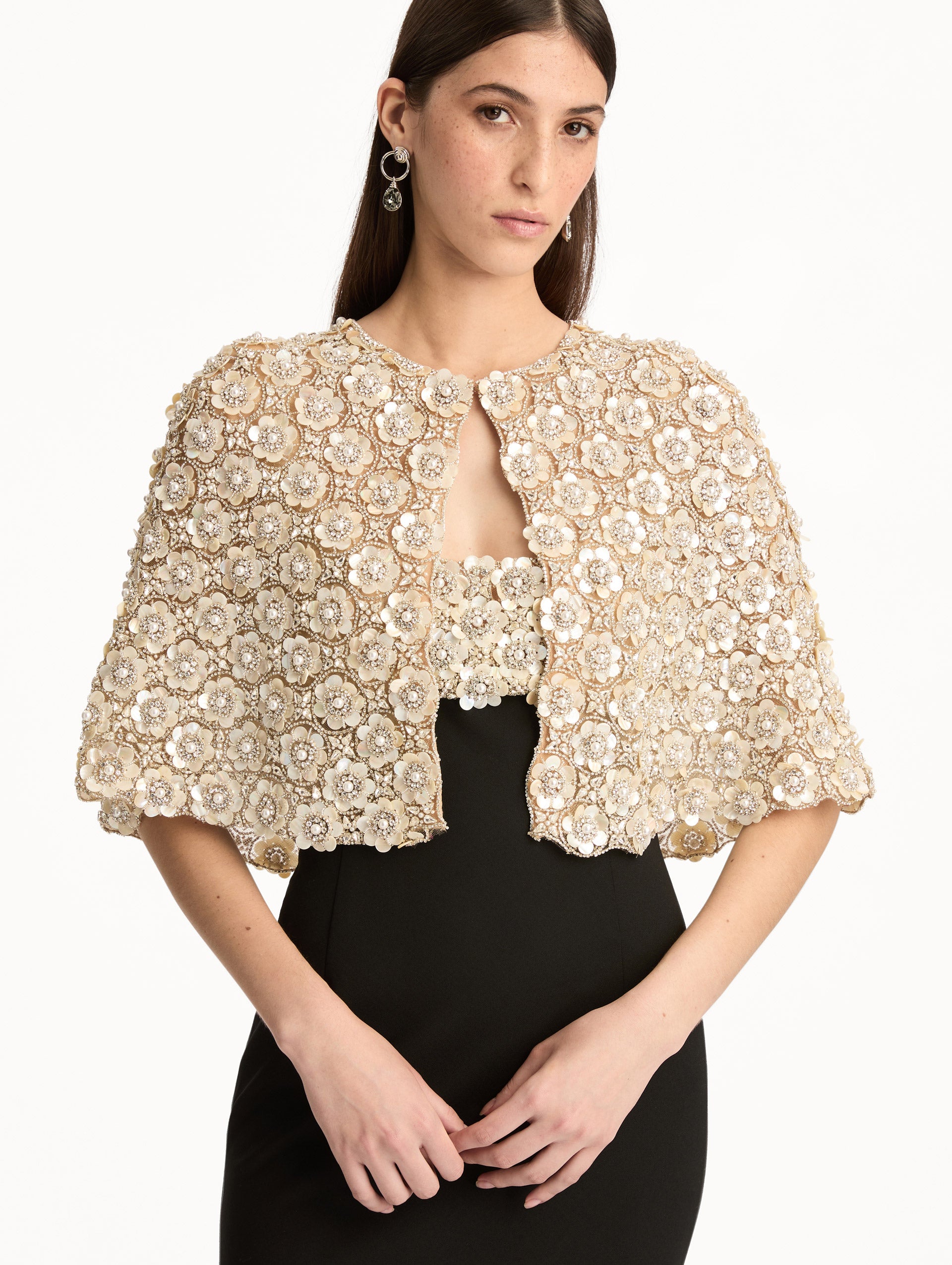 Mother of Pearl Embroidered Capelet embellished with crystal floral appliqué. Front View.