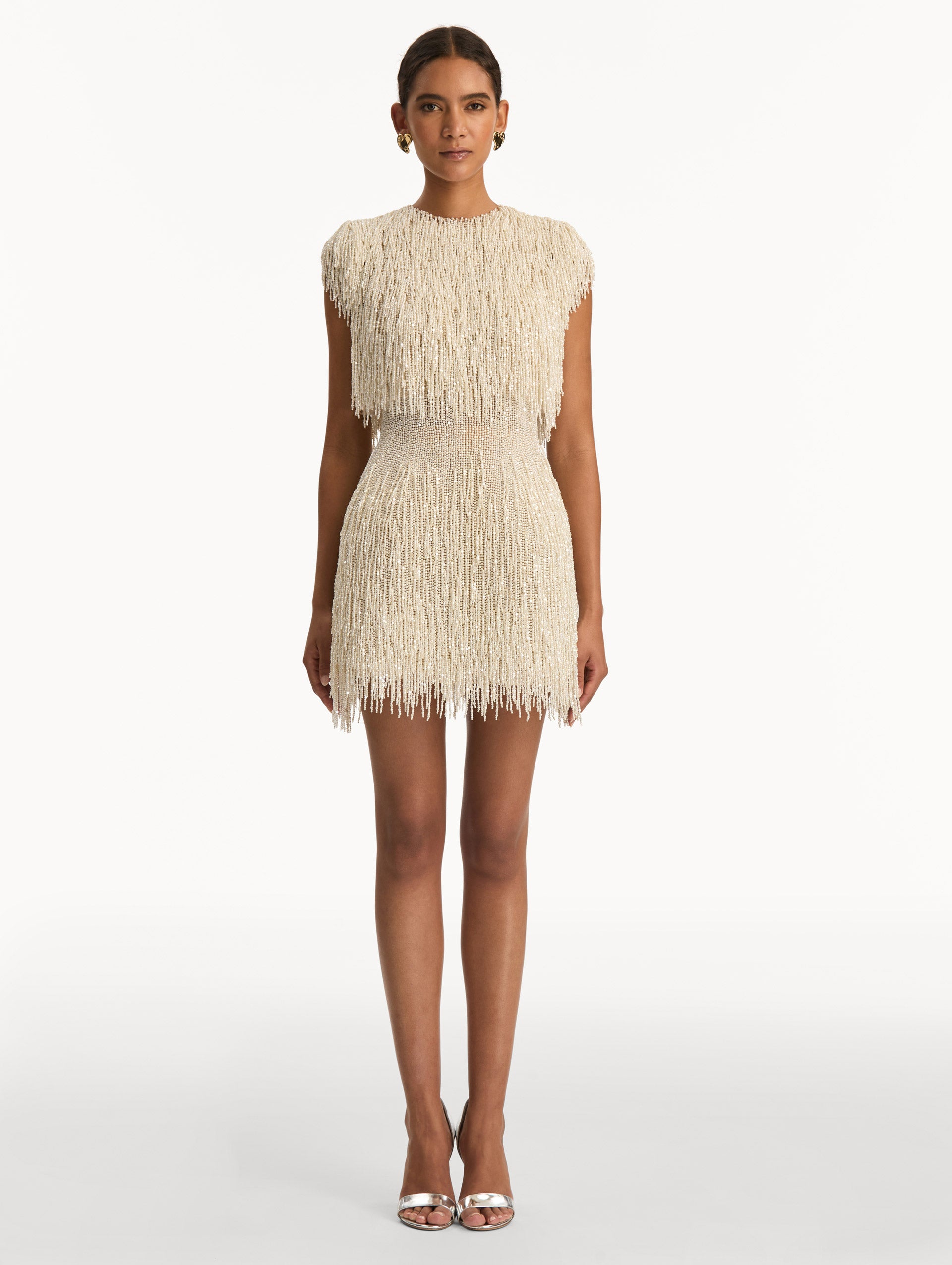 Ivory Pearl Fringe Cocktail Dress featuring a fitted silhouette with cascading beaded fringe embellishments. Front View.