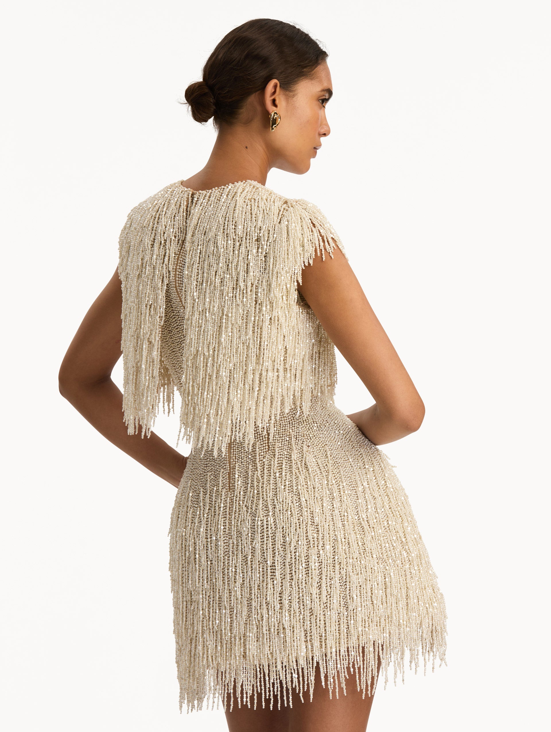 Ivory Pearl Fringe Cocktail Dress featuring a fitted silhouette with cascading beaded fringe embellishments. Back View.