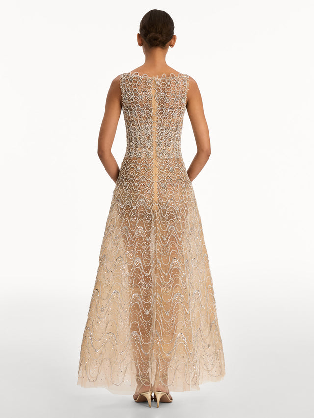 Beige Crystal Wave Embroidered Dress with strapless wave neckline and sheer metallic finish. Back View.