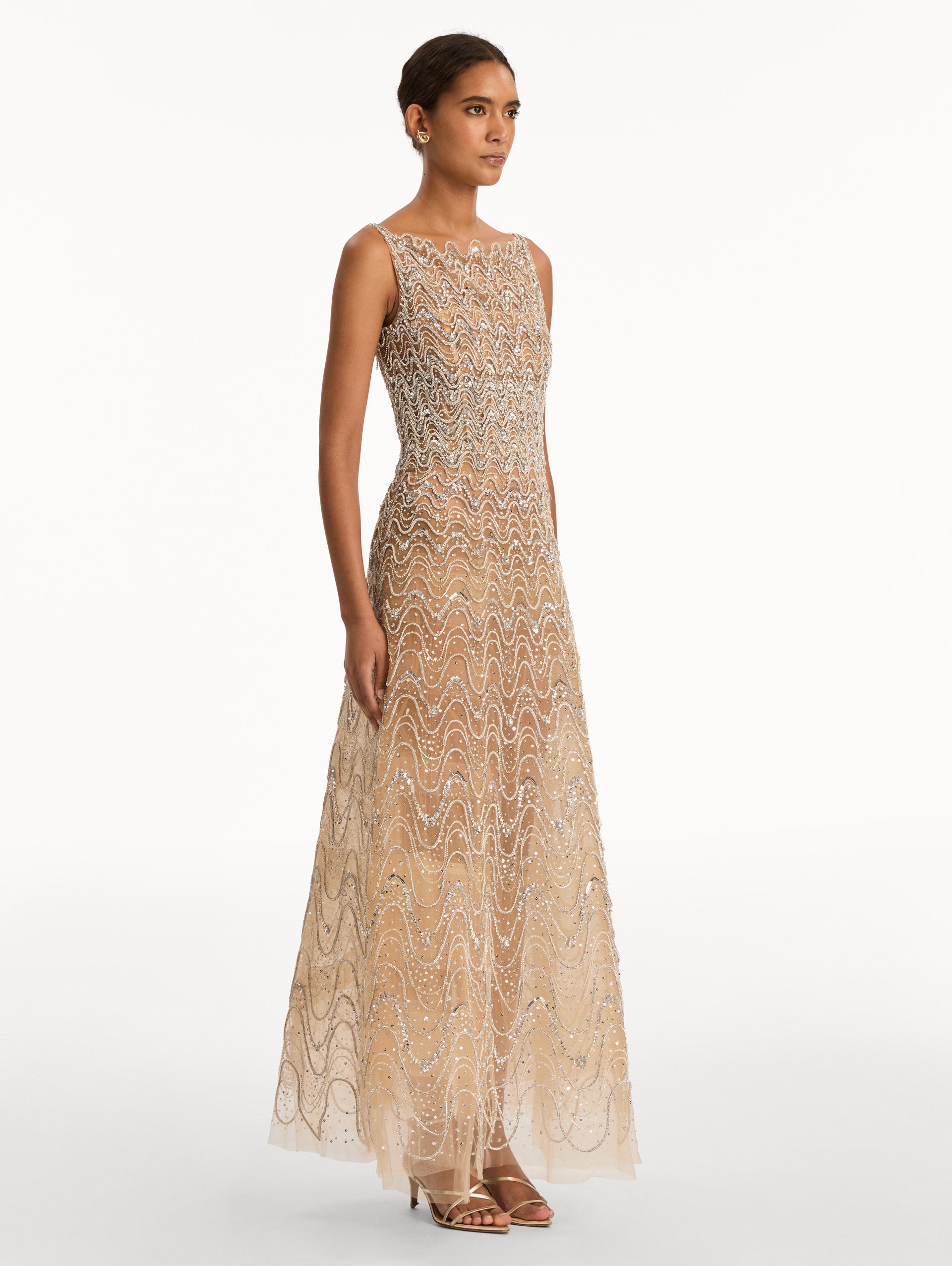 Beige Crystal Wave Embroidered Dress with strapless wave neckline and sheer metallic finish. Side View.
