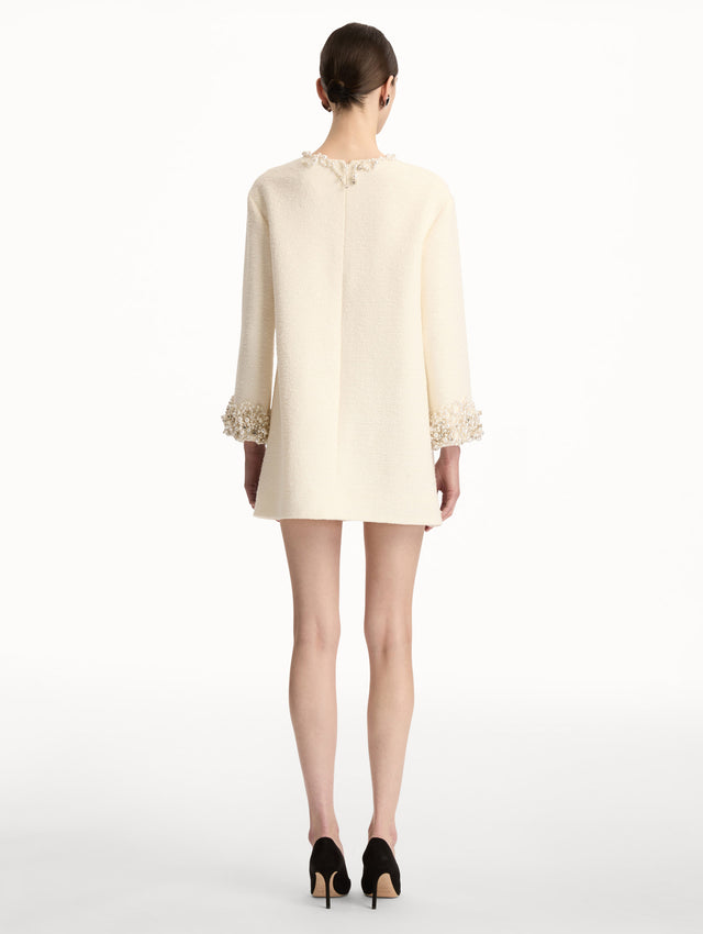 White Pearl Embroidered Tweed Shift Dress featuring embellished sleeves and pleated neckline. Back View. 