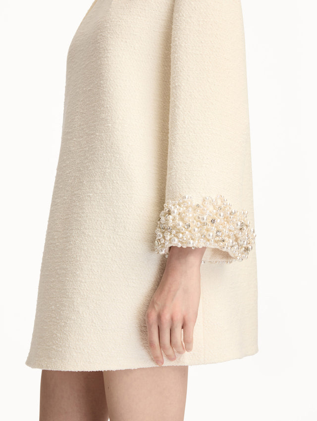 White Pearl Embroidered Tweed Shift Dress featuring embellished sleeves and pleated neckline. Zoom View. 