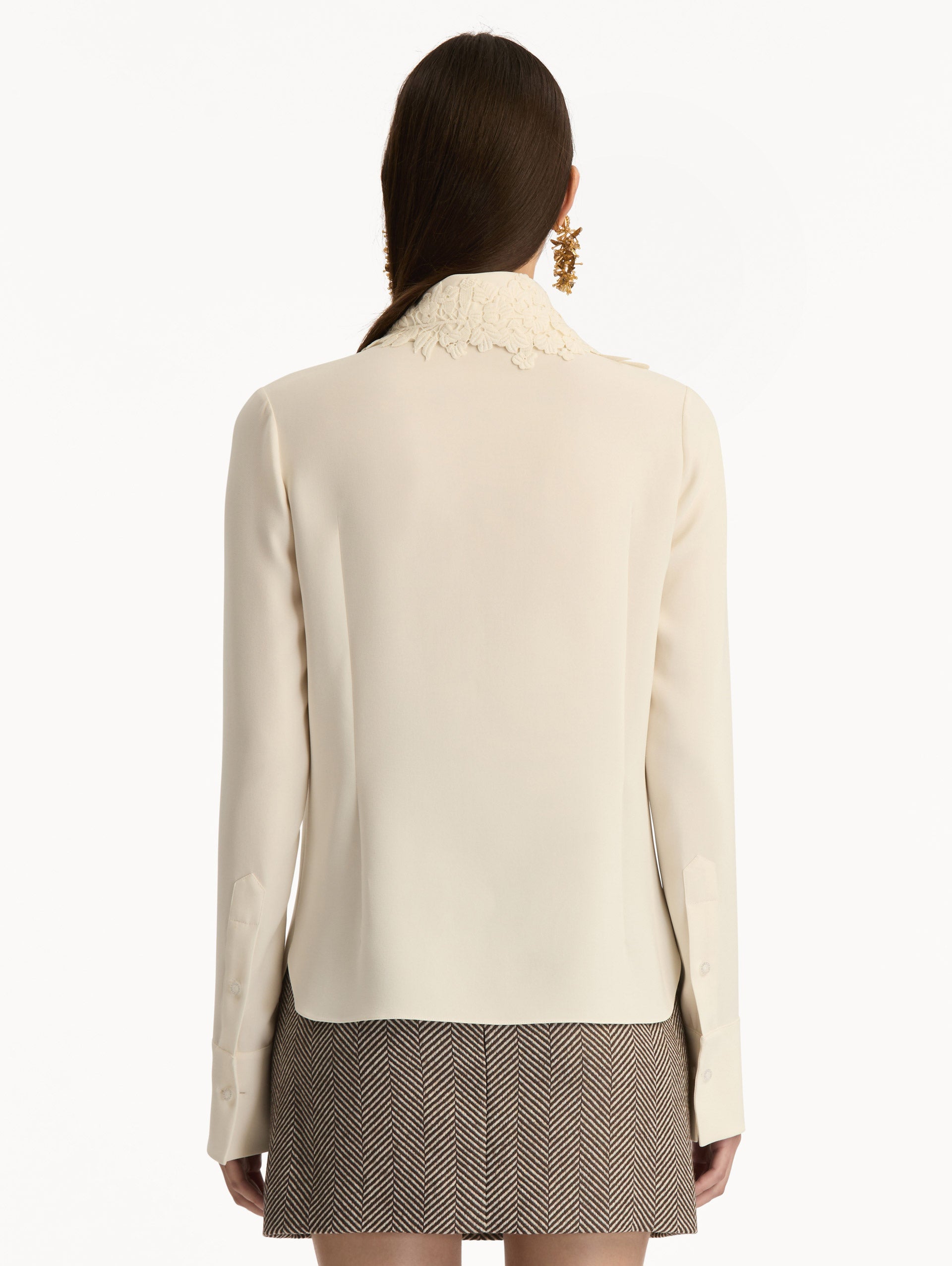 Ivory Foxglove Tie-Neck Georgette Blouse featuring a floral applique and long sleeves. Back View. 