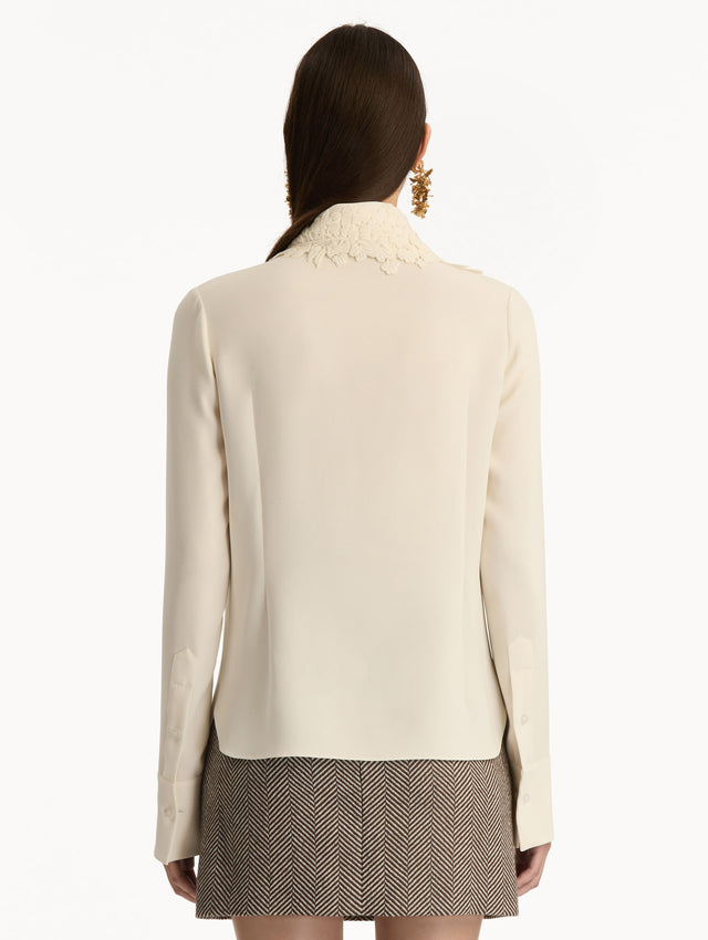 Ivory Foxglove Tie-Neck Georgette Blouse featuring a floral applique and long sleeves. Back View. 