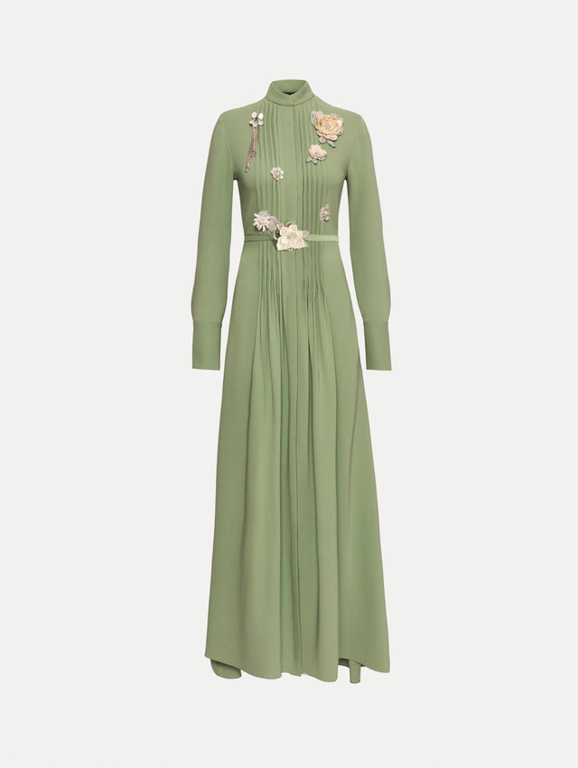 Green Brooch Embroidered Long Sleeve Caftan featuring pleated front detailing, high neckline, and floral appliqué embellishments at the bodice and waist.
