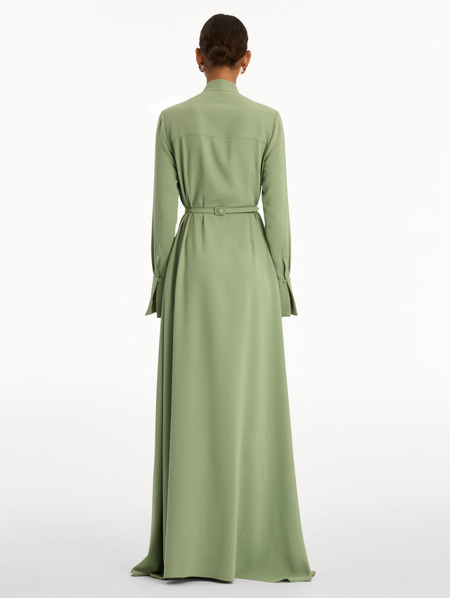 Green Brooch Embroidered Long Sleeve Caftan featuring pleated front detailing, high neckline, and floral appliqué embellishments at the bodice and waist. Back View.
