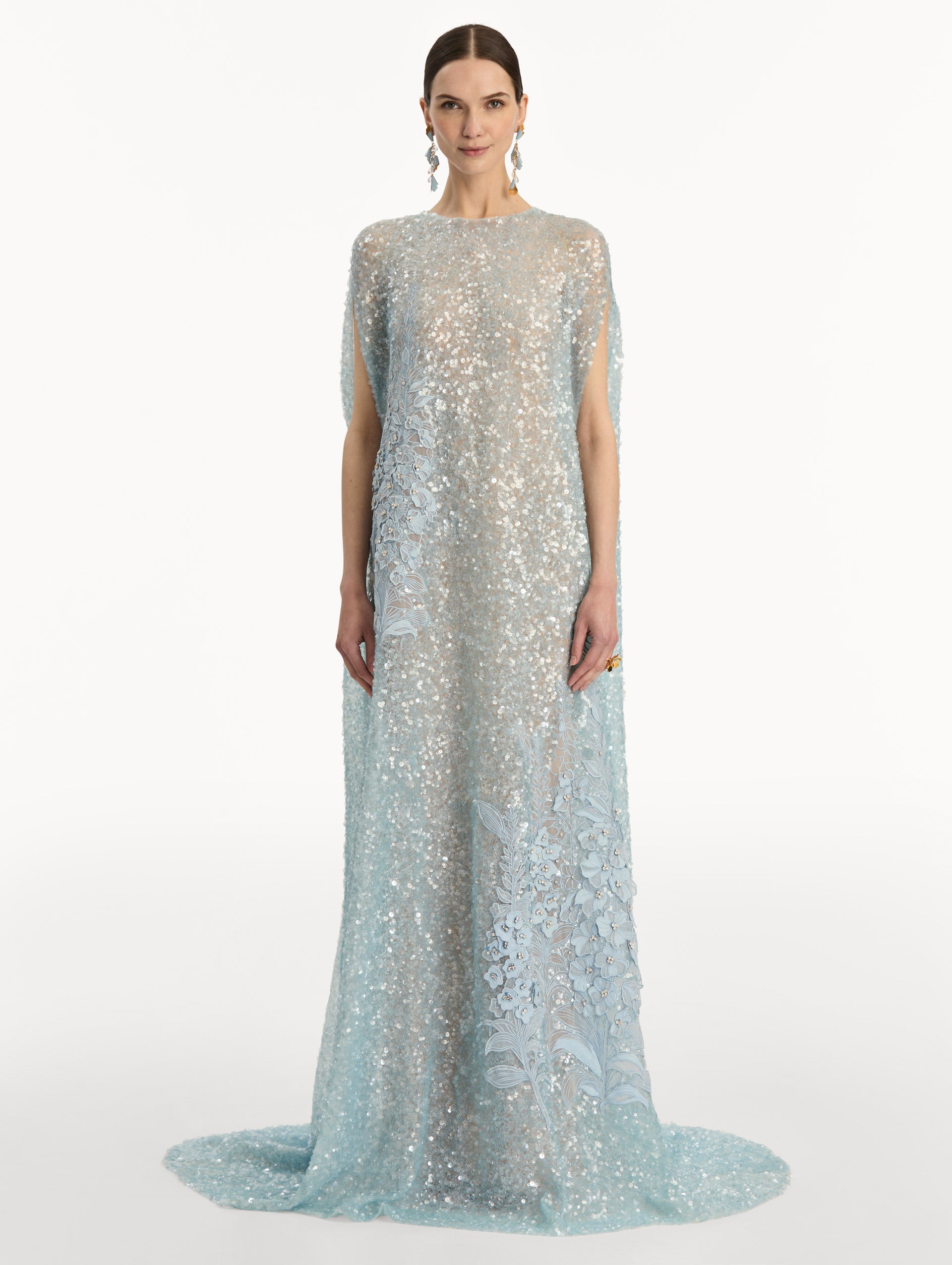 Light Blue Foxglove Embroidered Sequin Tulle Caftan with long caped sleeves and embroidered floral motifs. Front View.