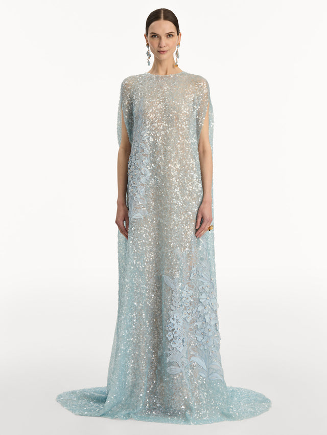 Light Blue Foxglove Embroidered Sequin Tulle Caftan with long caped sleeves and embroidered floral motifs. Front View.