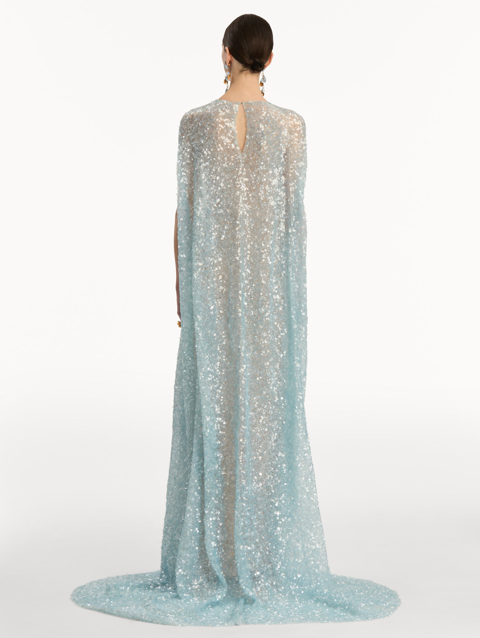 Light Blue Foxglove Embroidered Sequin Tulle Caftan with long caped sleeves and embroidered floral motifs. Back View.