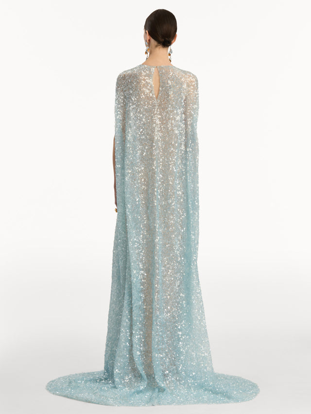 Light Blue Foxglove Embroidered Sequin Tulle Caftan with long caped sleeves and embroidered floral motifs. Back View.