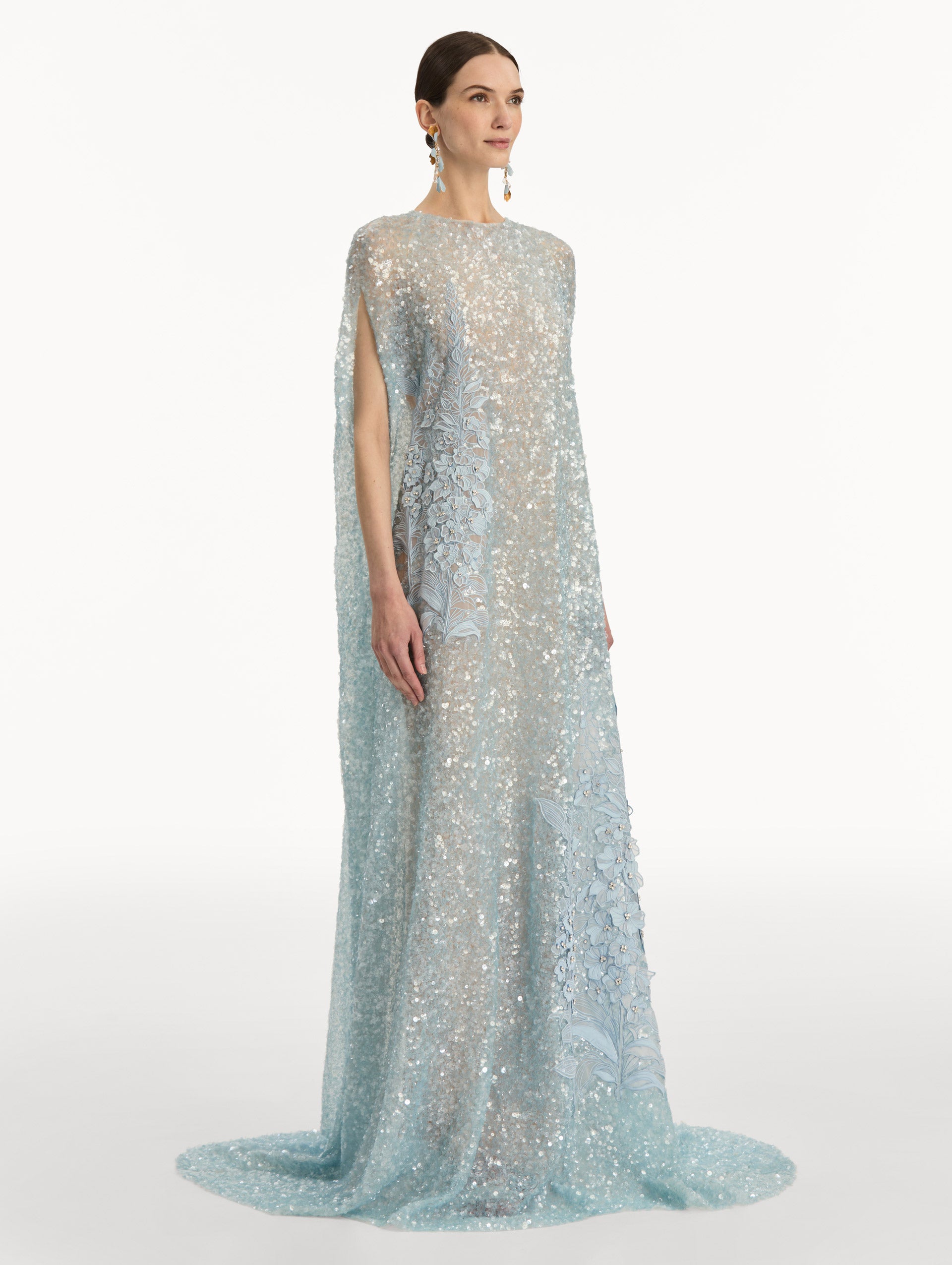 Light Blue Foxglove Embroidered Sequin Tulle Caftan with long caped sleeves and embroidered floral motifs. Side View.