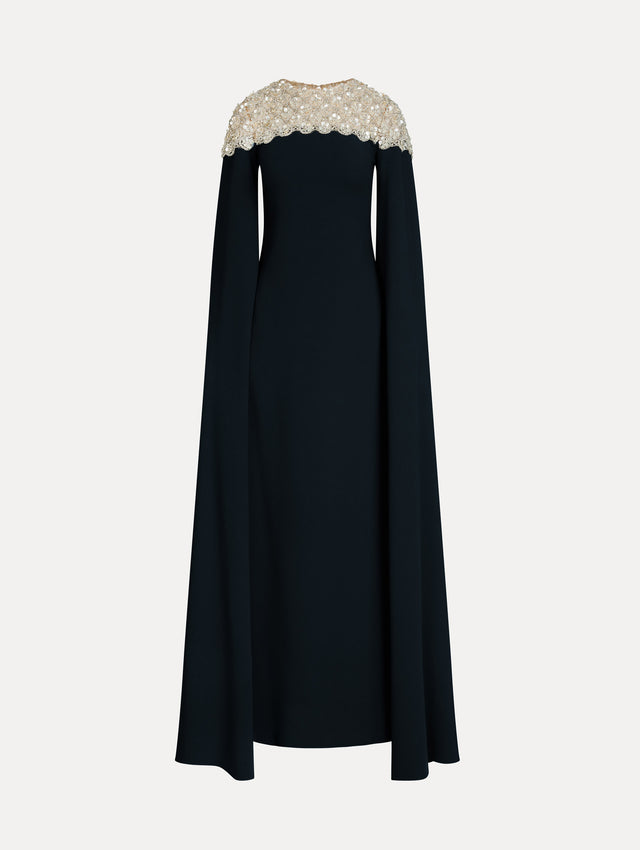 Navy Mother of Pearl Embroidered Caftan with ivory embroidered neckline and floor-length draped silhouette. Front View.