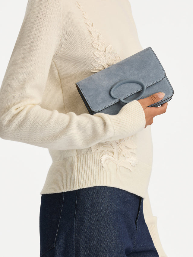 Blue O Pochette in Suede with gold strap and blue abstract O Clasp. Front View. 