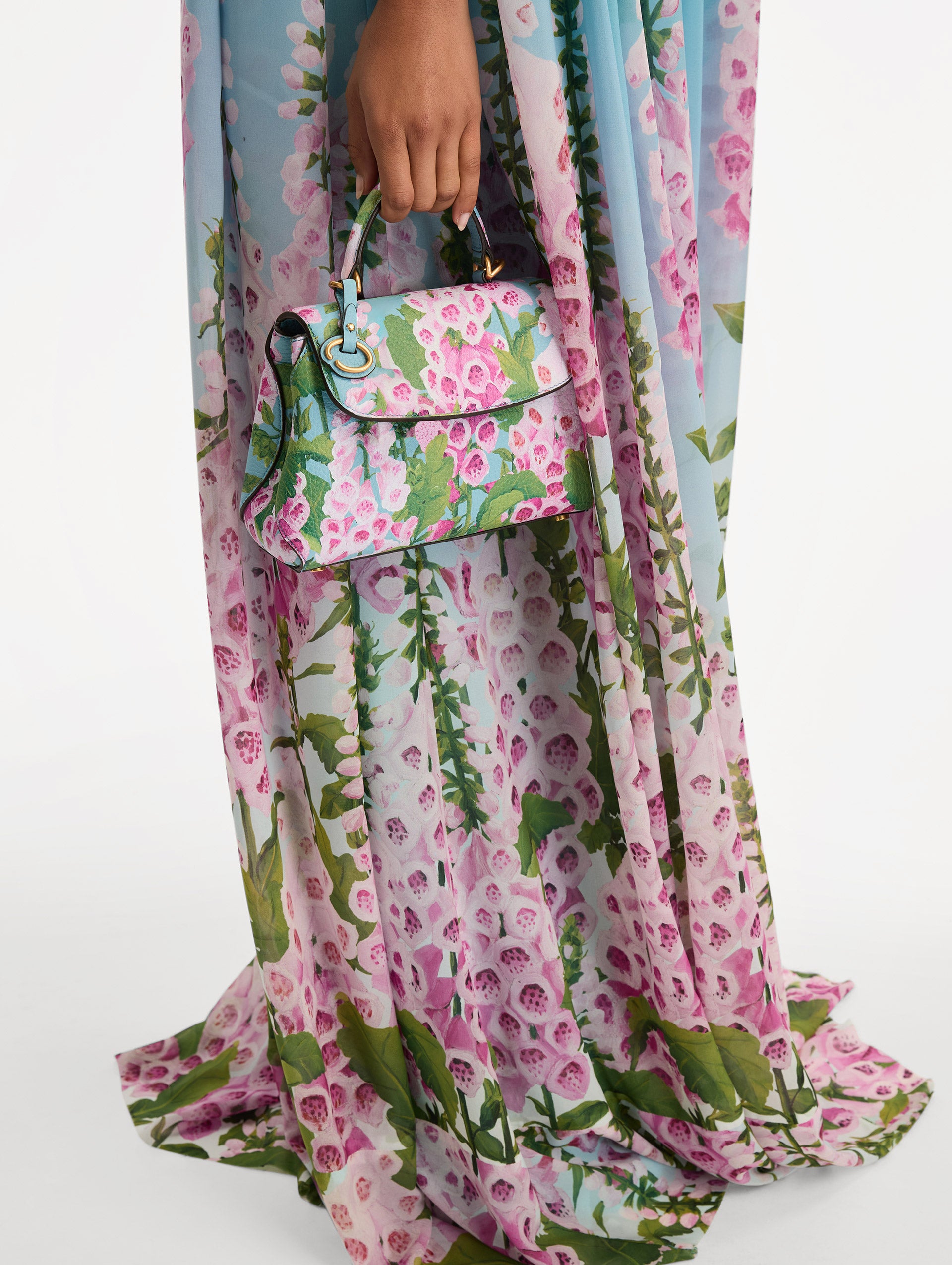 Blue, green, and pink Foxlove printed Mini Poppy with gold hardware. Front View.