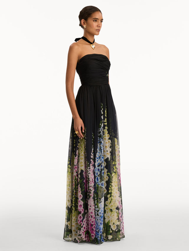 Black and Floral Degradé Foxglove Chiffon Gown with printed floral pattern and a strapless neckline. Side View.