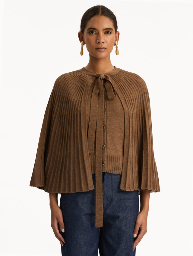 Brown Knit Capelet featuring a tie-neck closure, button front, and cropped silhouette. Front View.