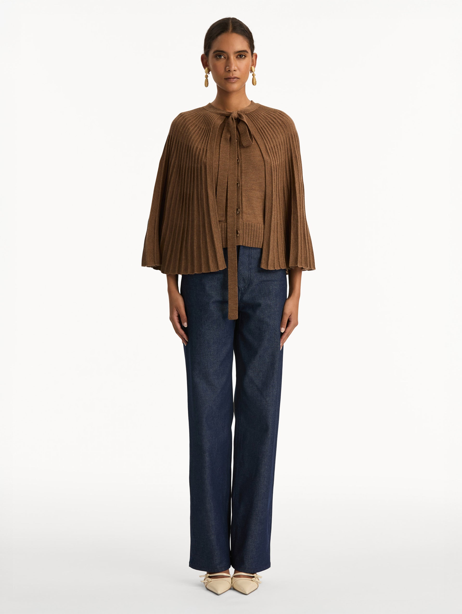 Brown Knit Capelet featuring a tie-neck closure, button front, and cropped silhouette. Front View.