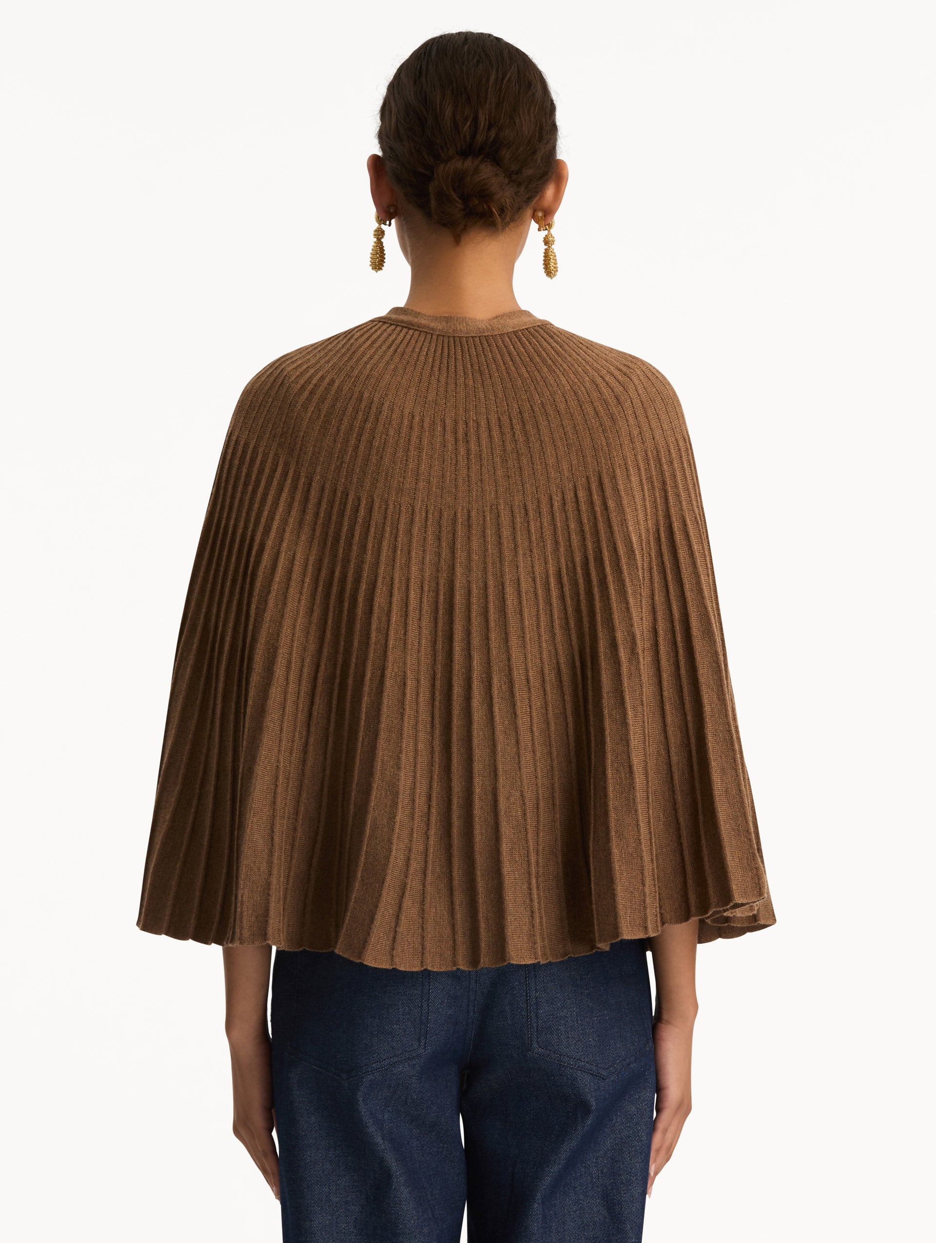 Brown Knit Capelet featuring a tie-neck closure, button front, and cropped silhouette. Back View.