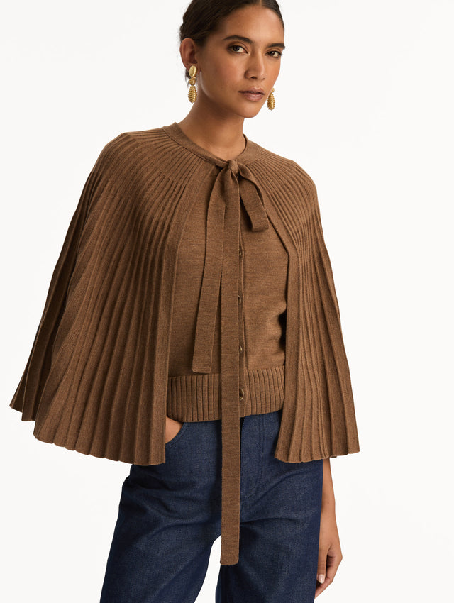 Brown Knit Capelet featuring a tie-neck closure, button front, and cropped silhouette. Zoom View.