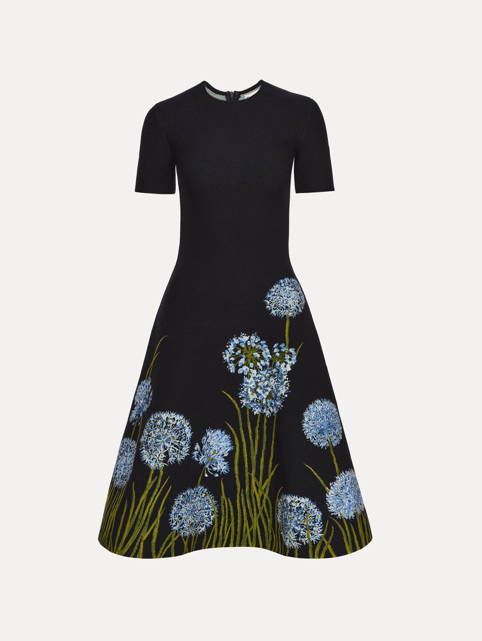 Navy Allium Jacquard Knit Dress featuring blue floral embroidery with green stem detailing along the skirt.