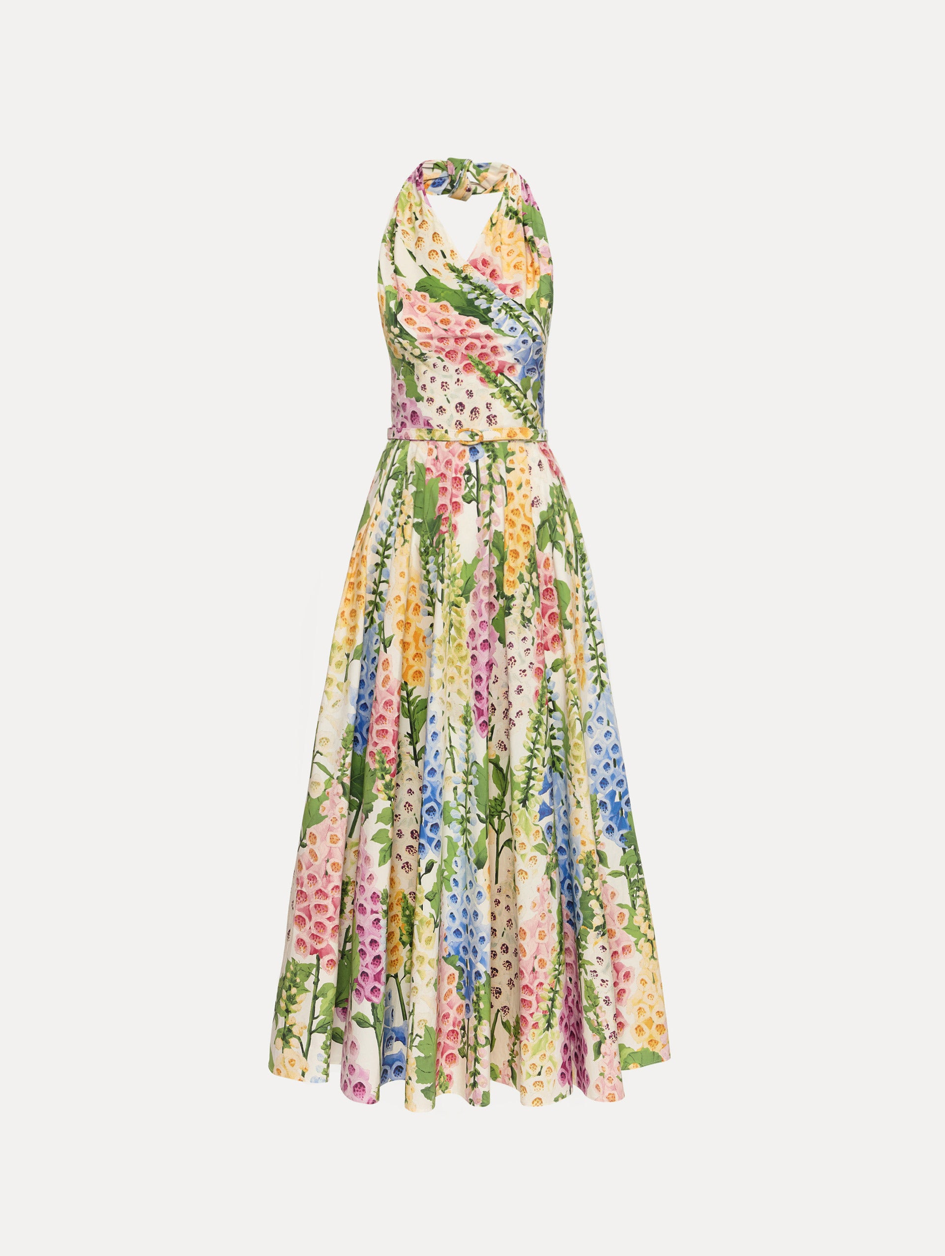 Foxglove Cotton Poplin Halter Dress with a fitted bodice and flowing skirt, featuring a colorful floral print in shades of pink, yellow, blue, and green.