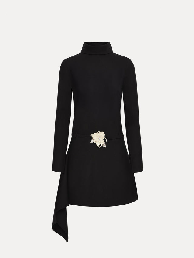 Black Floral Belt Mock-Neck Dress featuring a belt with a white flower and a black drape detail.