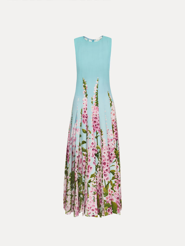 Blue Degradé Foxglove Chiffon Inset Dress featuring vertical pleats and a multicolor pink floral motif rising from the hem.