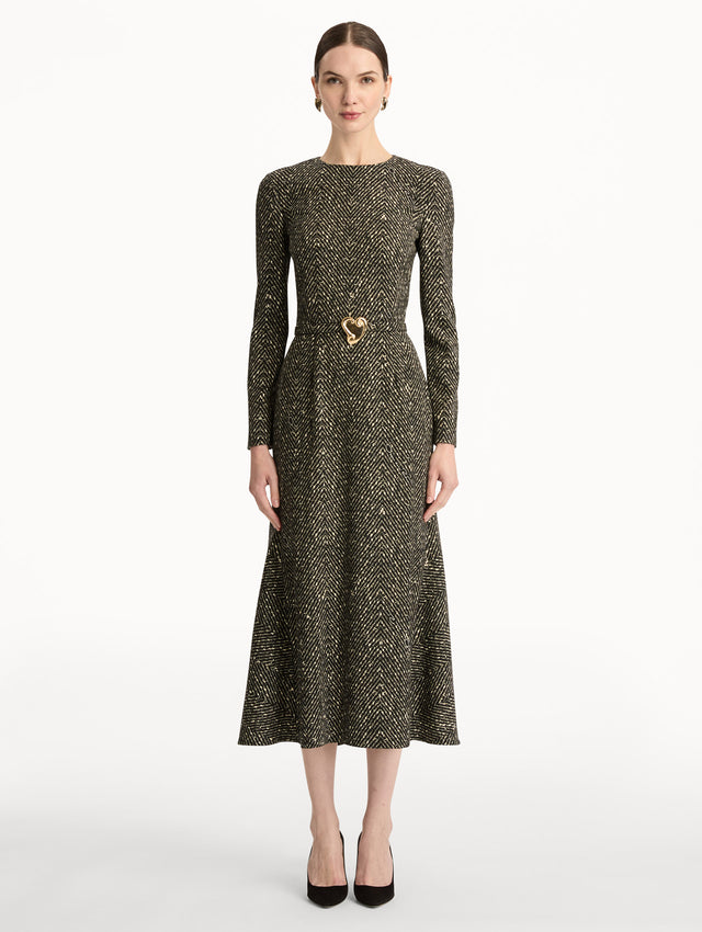 Black and Ivory Chevron Wool Dress featuring long-sleeves and a fitted waist with a sculptural gold heart accent. Front View.