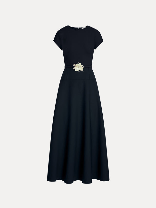 Navy Floral Belt Short Sleeve Dress with short sleeves and a belted waist featuring a white floral accent. Front View.