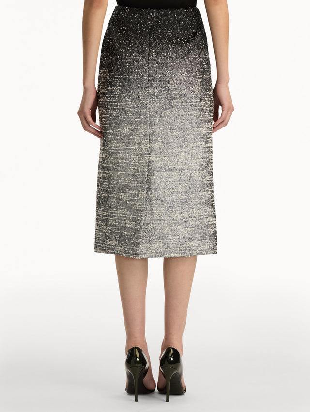 Black and Ivory Ombré Lurex Bouclé Jacquard Skirt featuring a fitted silhouette and a textured metallic finish. Back View.