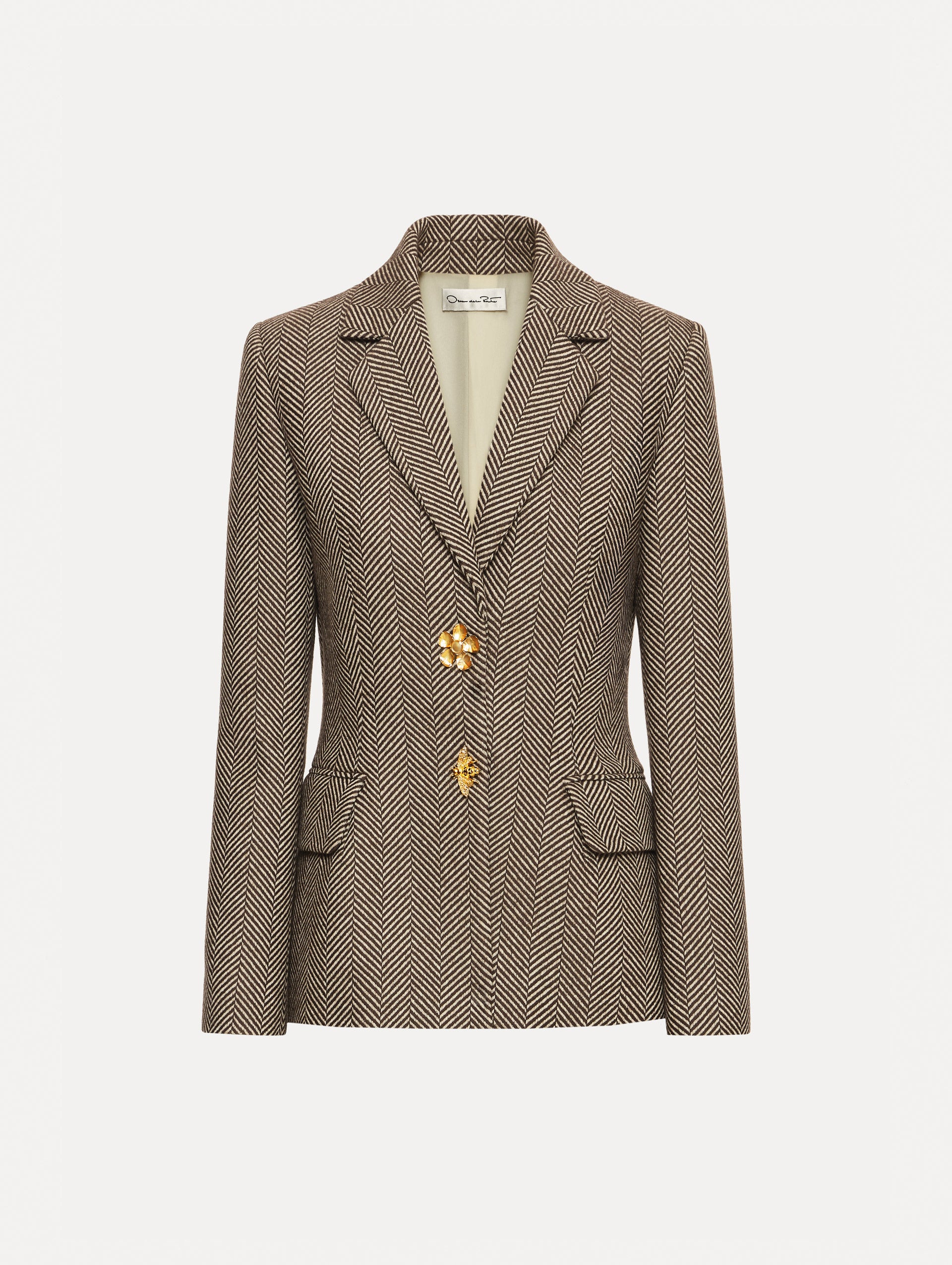 Brown and Ivory Chevron Cashmere-Blend Jacket featuring peak lapels, flap pockets, tailored seams, and gold floral buttons.