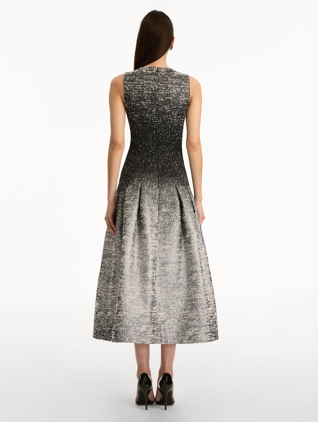 Black and ivory ombré lurex bouclé jacquard dress with fitted silhouette and textured metallic finish. Back View.