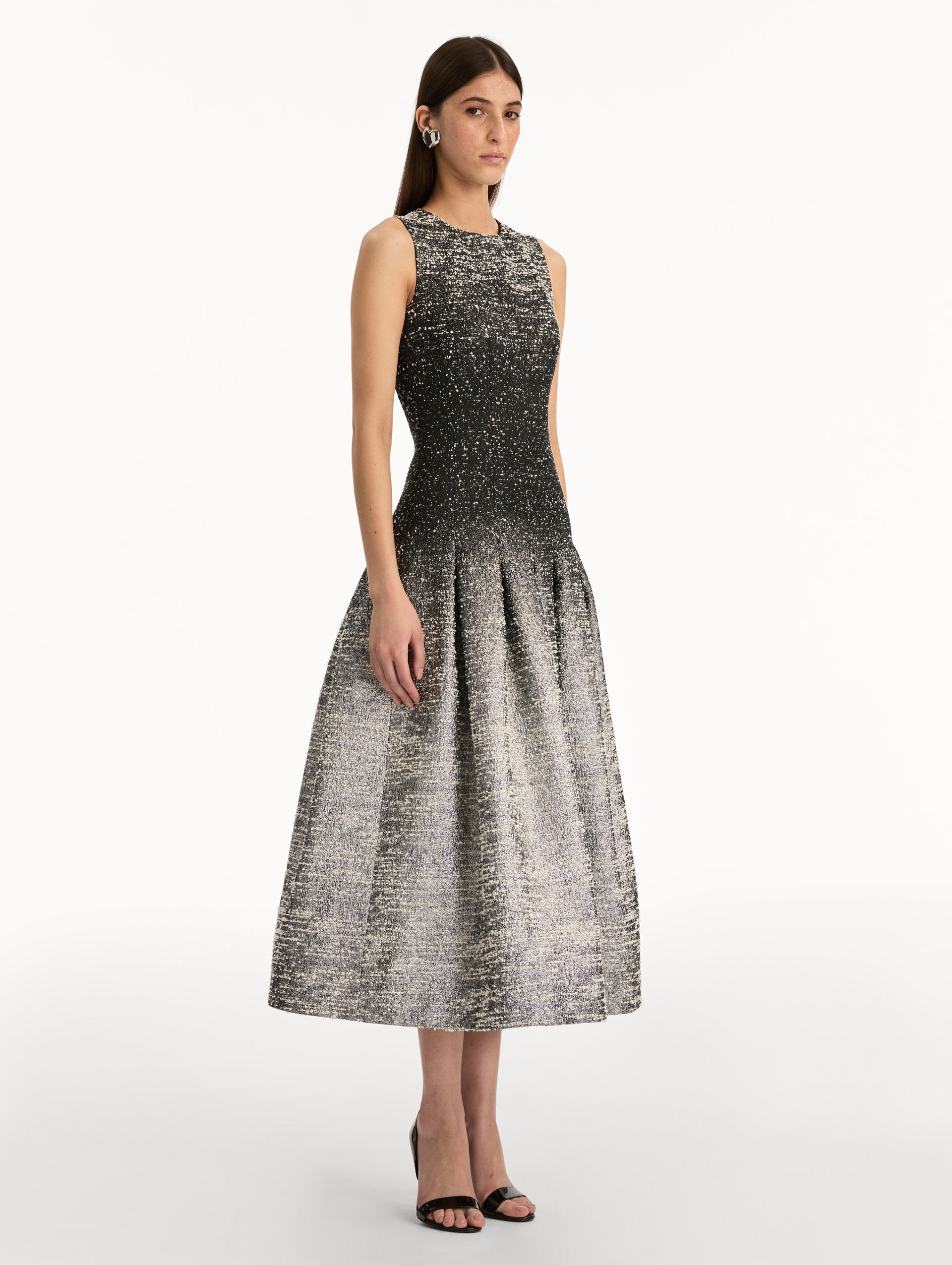Black and ivory ombré lurex bouclé jacquard dress with fitted silhouette and textured metallic finish. Side View.