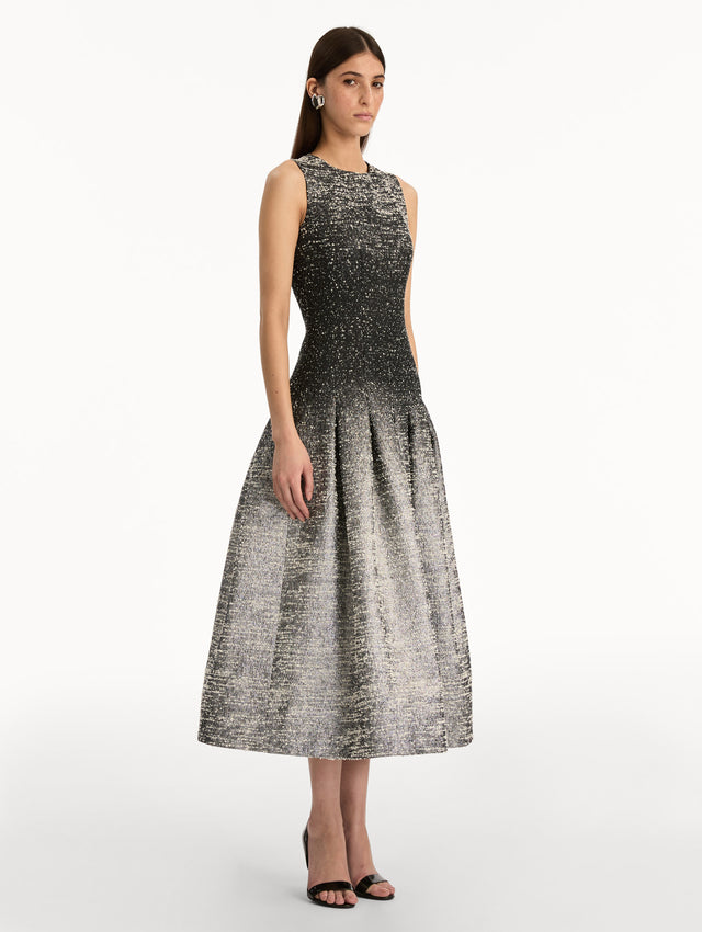 Black and ivory ombré lurex bouclé jacquard dress with fitted silhouette and textured metallic finish. Side View.
