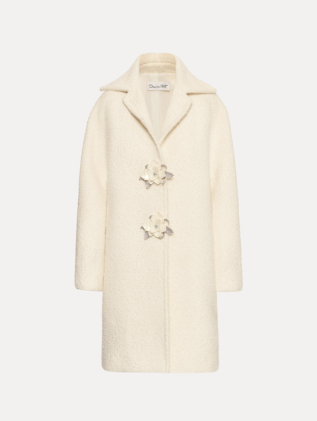Ivory Floral Button Bouclé Tweed Coat with notched lapels, featuring two floral crystal-embellished clasps at the front.