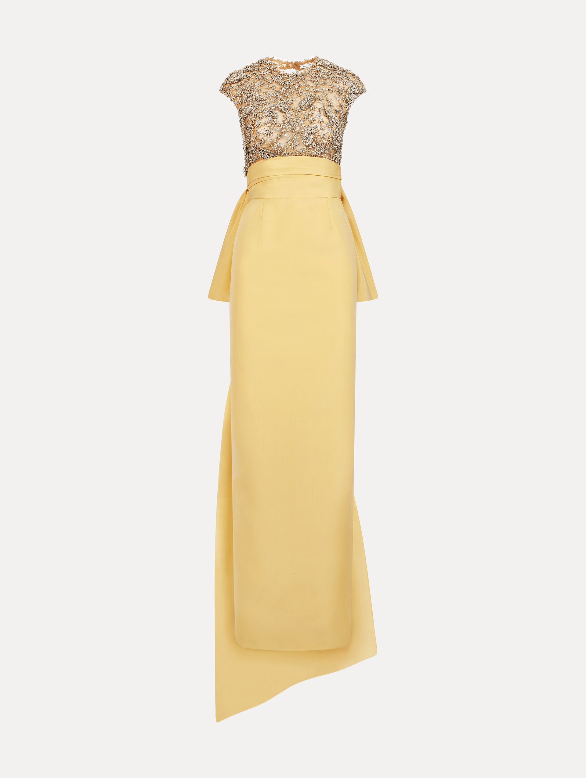 Yellow floor length gown with crystal porcelain flowers on an open back sculpted bodice. Dramatic faille skirt with cascading peplum train. Front View.