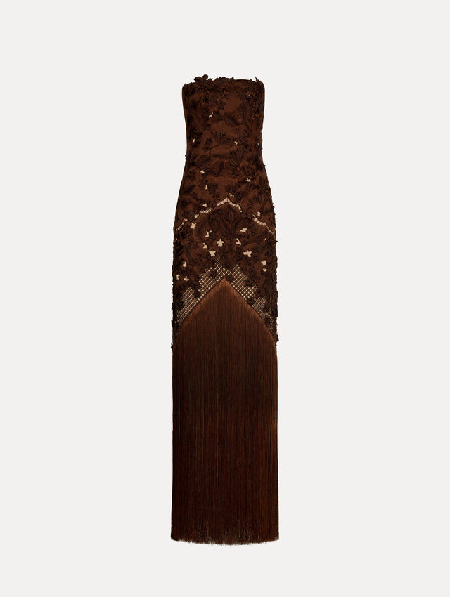 Strapless dress in the color Mahogany Brown with intricate floral lace detail and maxi length full fringe skirt.