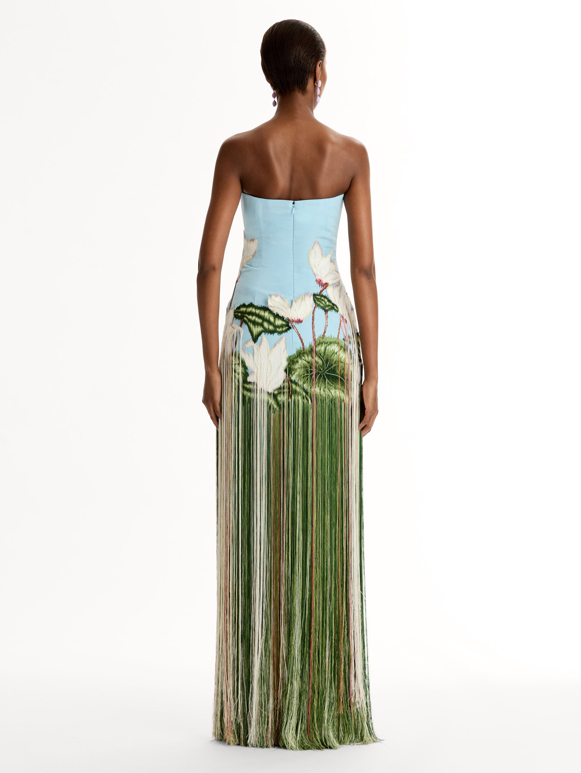 Strapless, Floor length silk faille gown with Chiné Cyclamen motif on threadwork fringe. Clean lines and a fitted bodice frame the  embroidery. Back View.